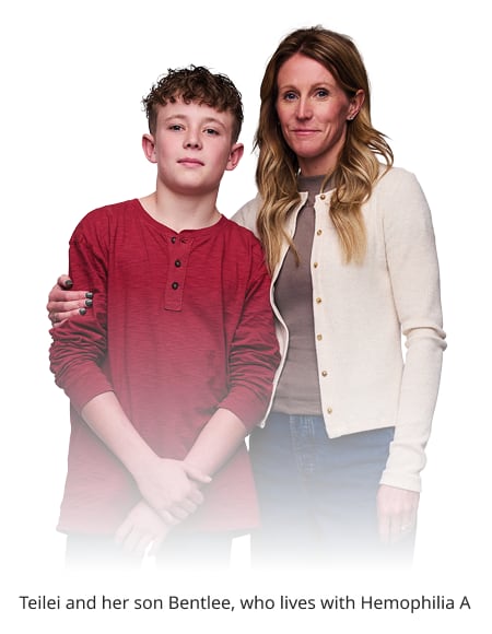 a woman and her son standing together looking at the camera