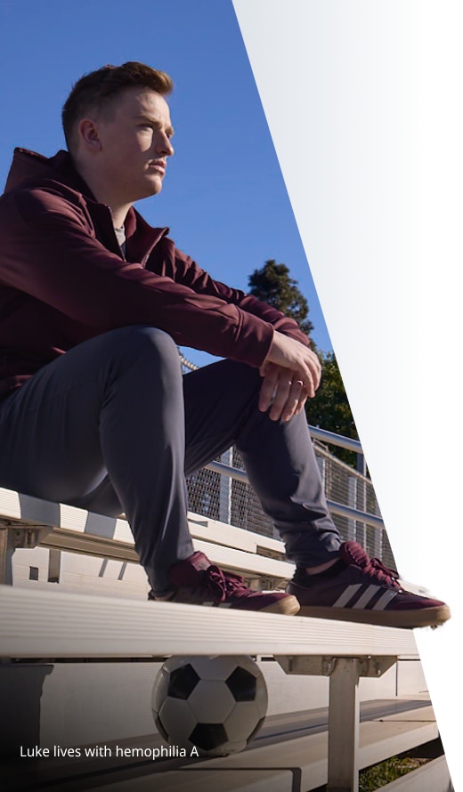Image of man seated on bleachers